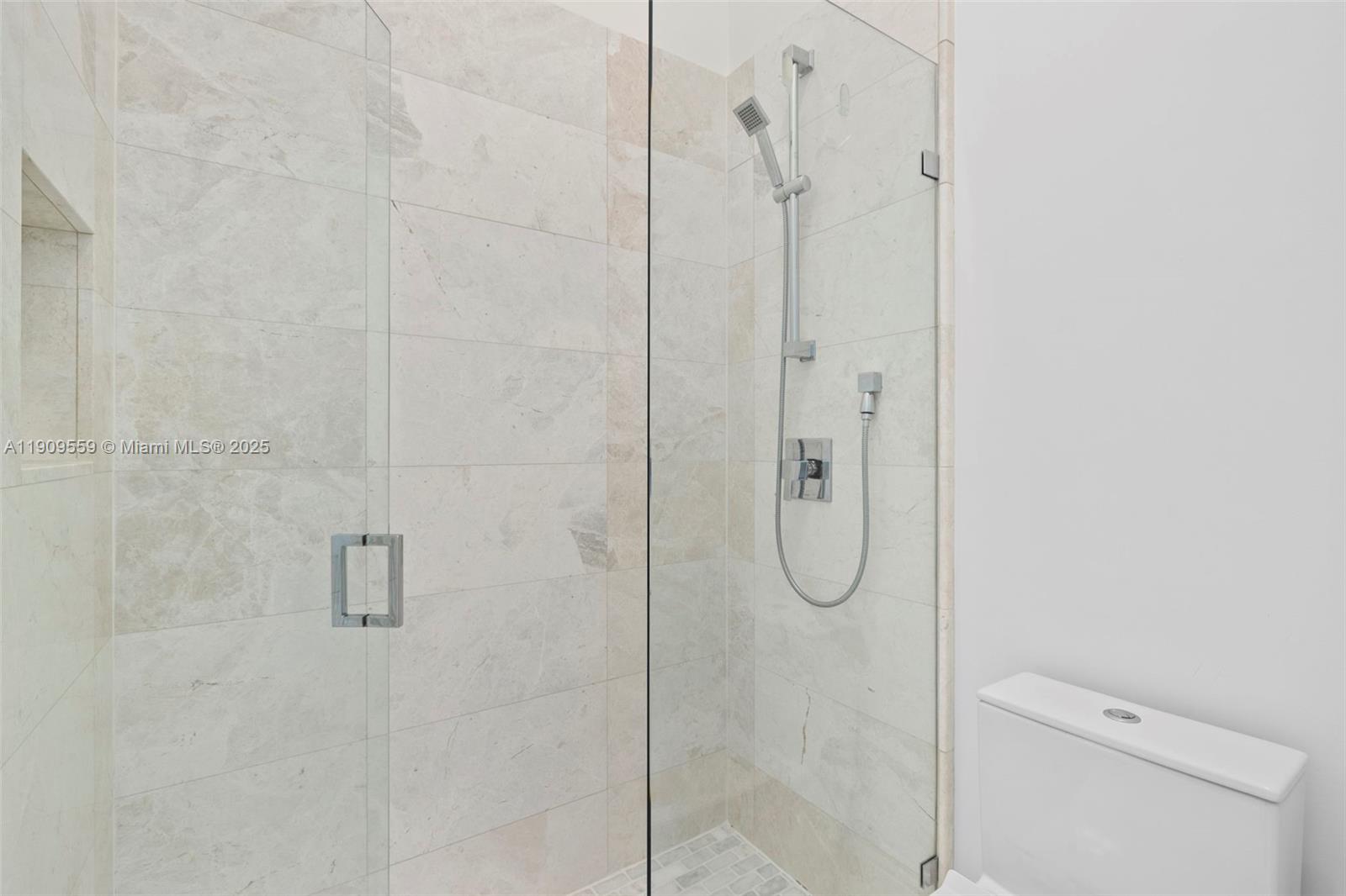 9580 Southwest 101st Terrace Miami, FL 33176 - Photo 28 of 88 a bathroom with a glass shower door