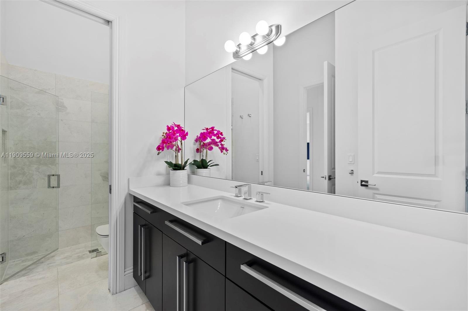 9580 Southwest 101st Terrace Miami, FL 33176 - Photo 29 of 88 a bathroom with a sink vanity and a mirror