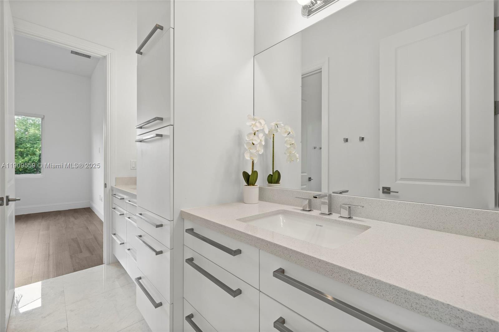 9580 Southwest 101st Terrace Miami, FL 33176 - Photo 32 of 88 a bathroom with a sink and a mirror