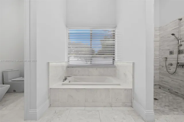 a kitchen with stainless steel appliances a stove sink and cabinets