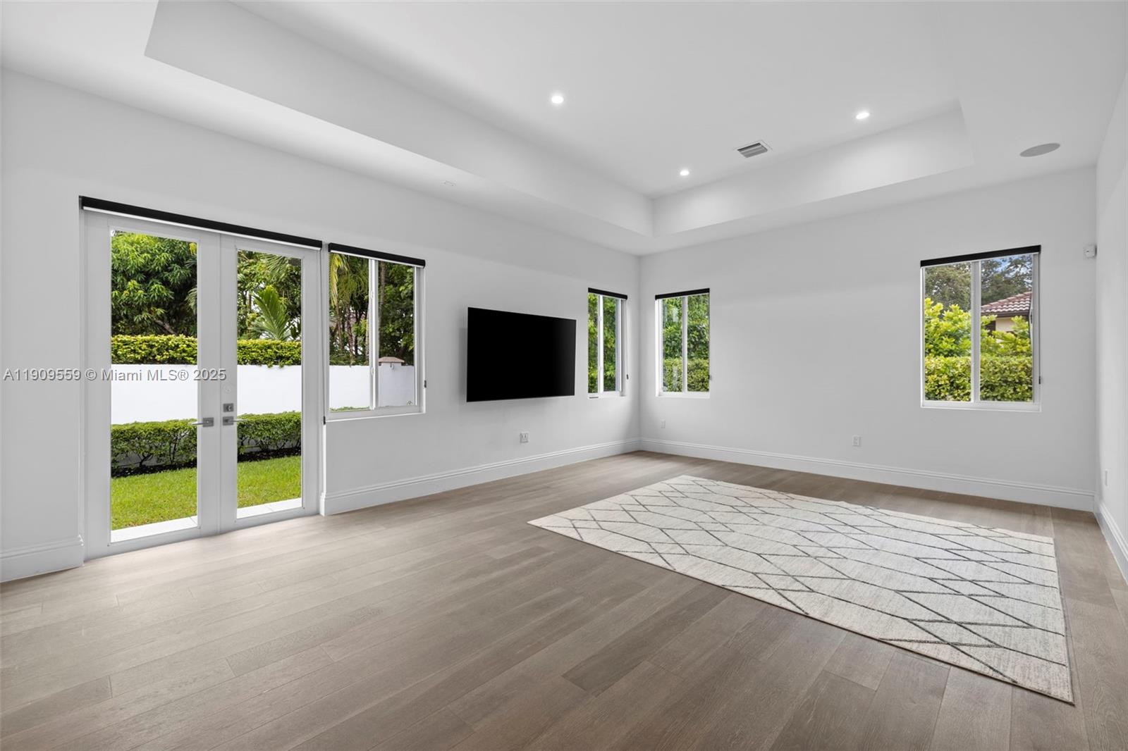 9580 Southwest 101st Terrace Miami, FL 33176 - Photo 46 of 88 a view of an empty room with a window and a flat screen tv