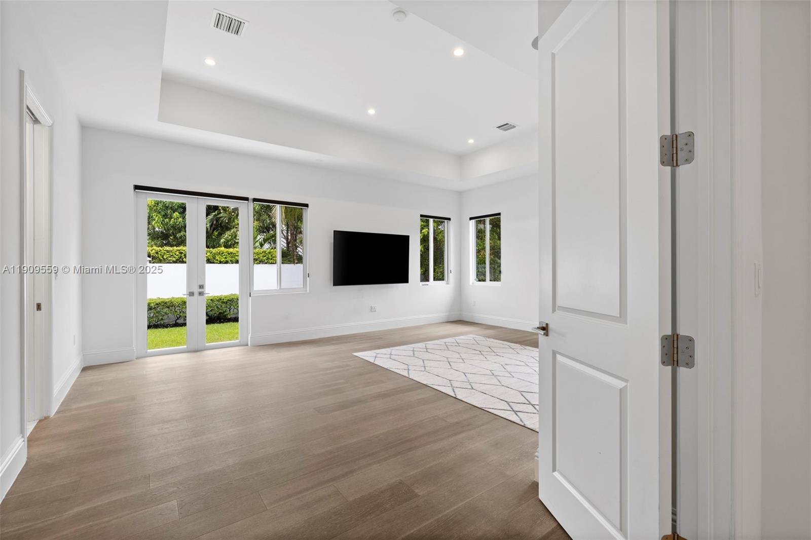 9580 Southwest 101st Terrace Miami, FL 33176 - Photo 47 of 88 a view of an empty room with a window and wooden floor