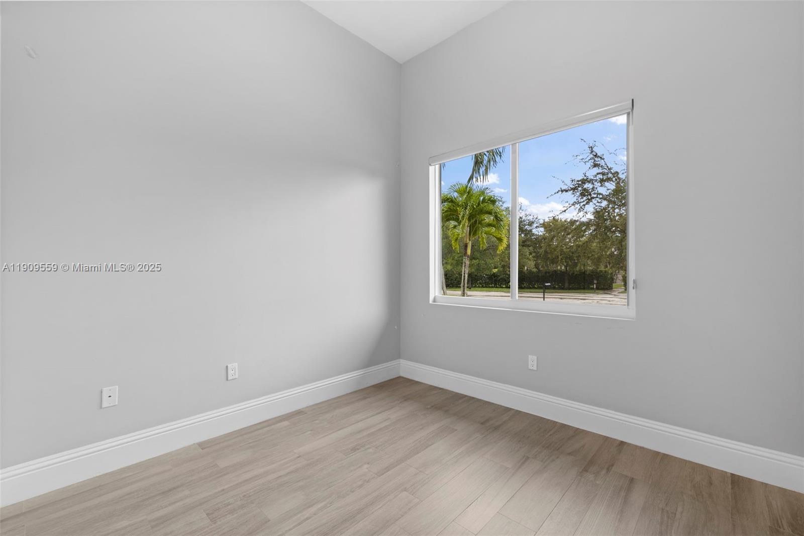 9580 Southwest 101st Terrace Miami, FL 33176 - Photo 51 of 88 an empty room with a window