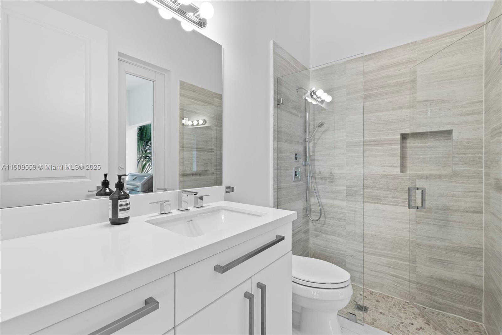 9580 Southwest 101st Terrace Miami, FL 33176 - Photo 54 of 88 a bathroom with a sink a toilet and shower