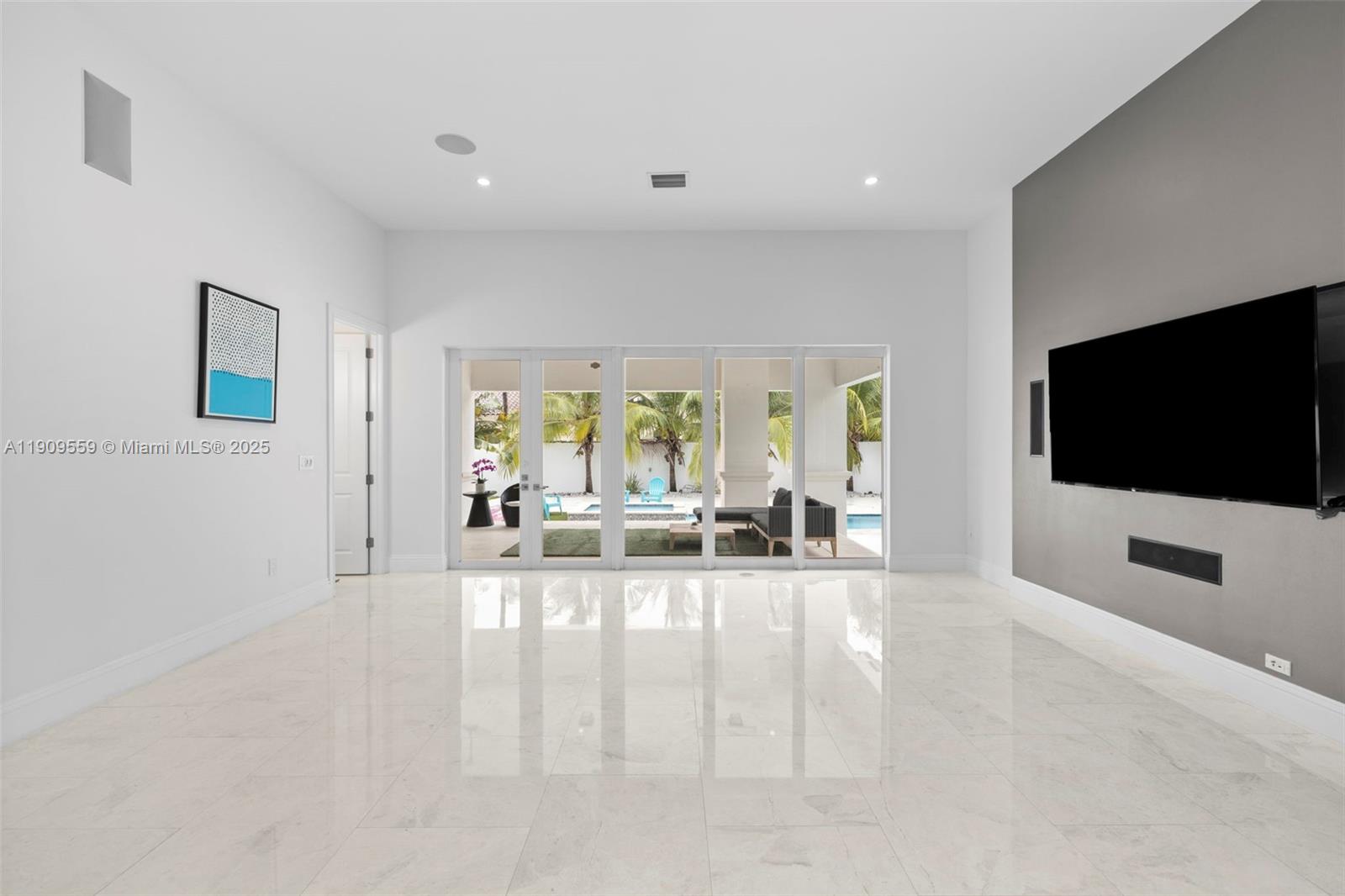 9580 Southwest 101st Terrace Miami, FL 33176 - Photo 58 of 88 a living room with furniture and a flat screen tv