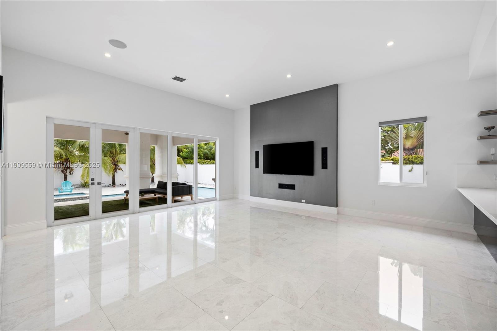 9580 Southwest 101st Terrace Miami, FL 33176 - Photo 59 of 88 a living room with furniture and a flat screen tv