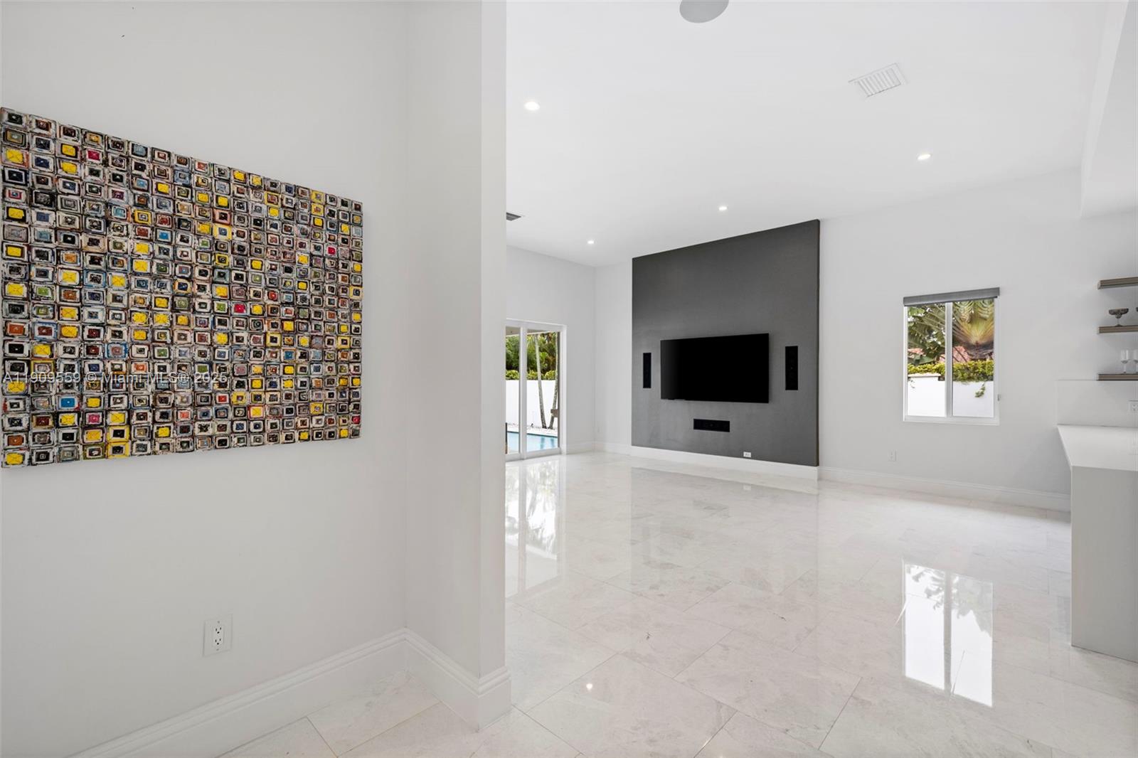 9580 Southwest 101st Terrace Miami, FL 33176 - Photo 60 of 88 a living room with a couch and a flat screen tv