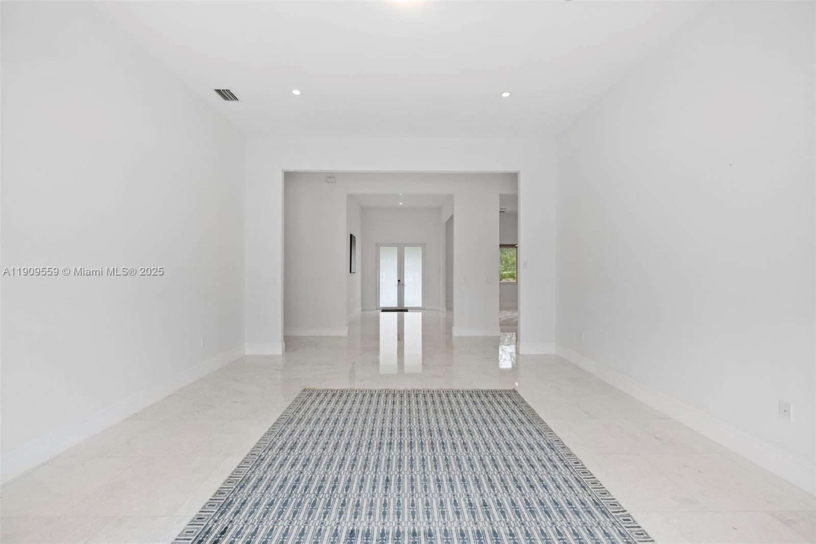 9580 Southwest 101st Terrace Miami, FL 33176 - Photo 74 of 88 a view of a room with wooden floor and white walls