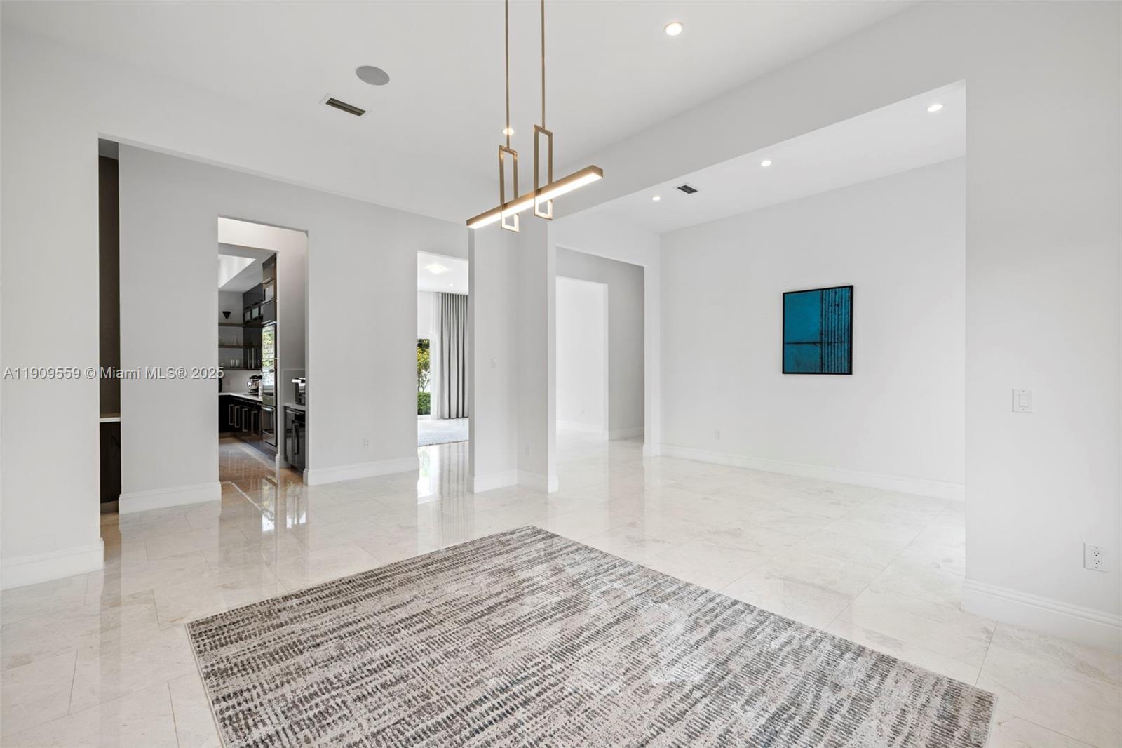 9580 Southwest 101st Terrace Miami, FL 33176 - Photo 76 of 88 a view of a hallway with wooden floor and a living room