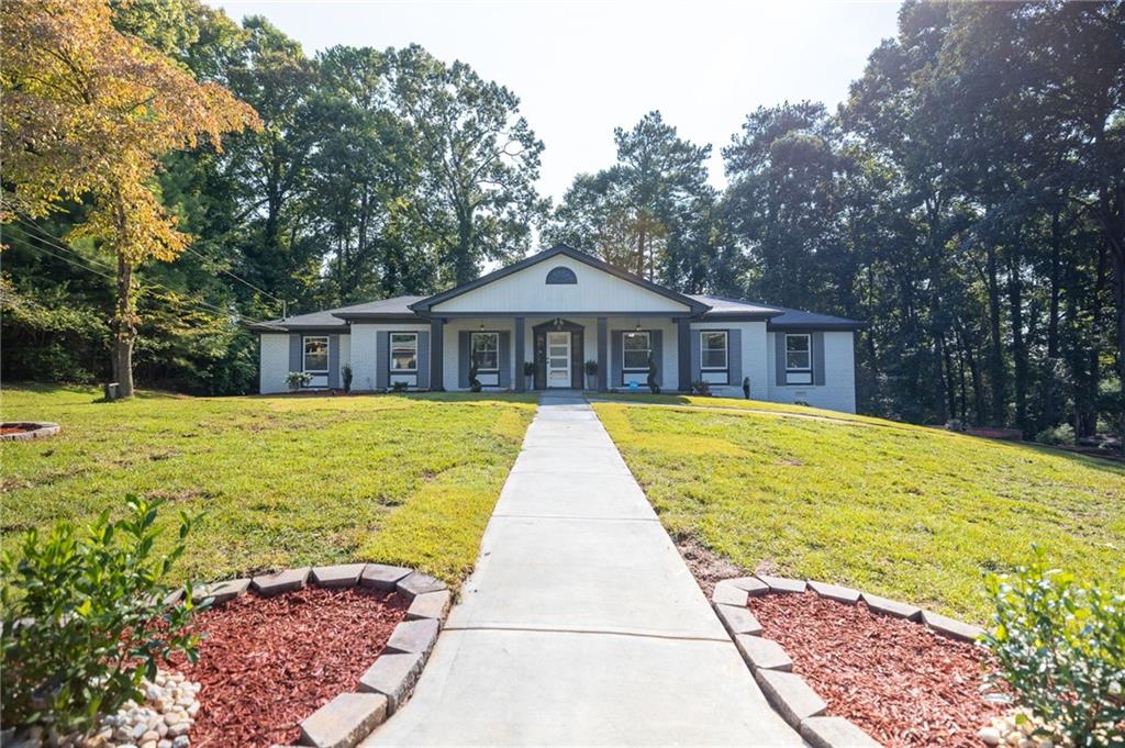 2410 Crestknoll Circle Decatur, GA 30032 - Photo 1 of 1 a view of swimming pool that has lawn chairs under an umbrella