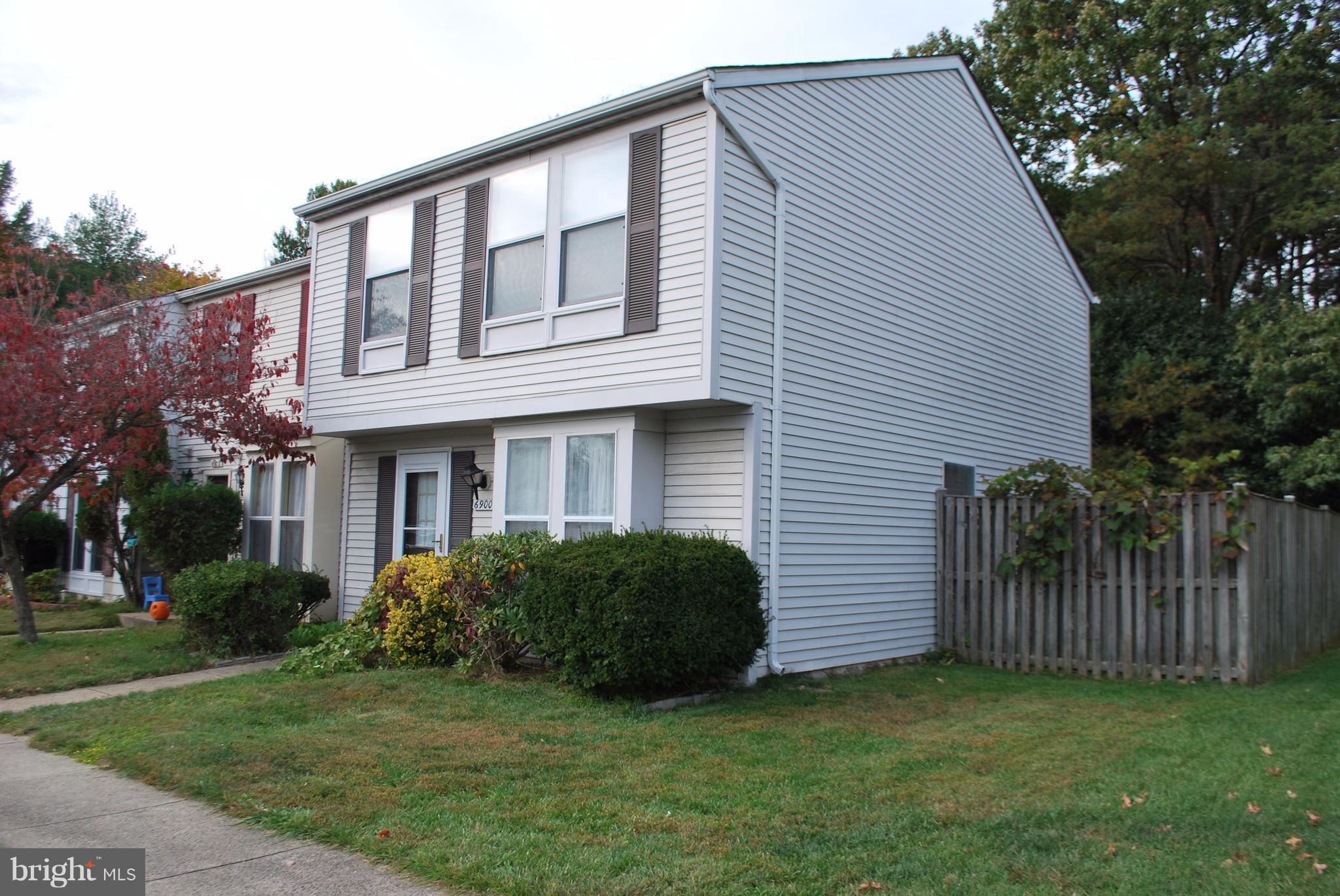6900 Villa-Del-Rey Court Springfield, VA 22150 - Photo 13 of 29 a view of a house with a yard and a garden