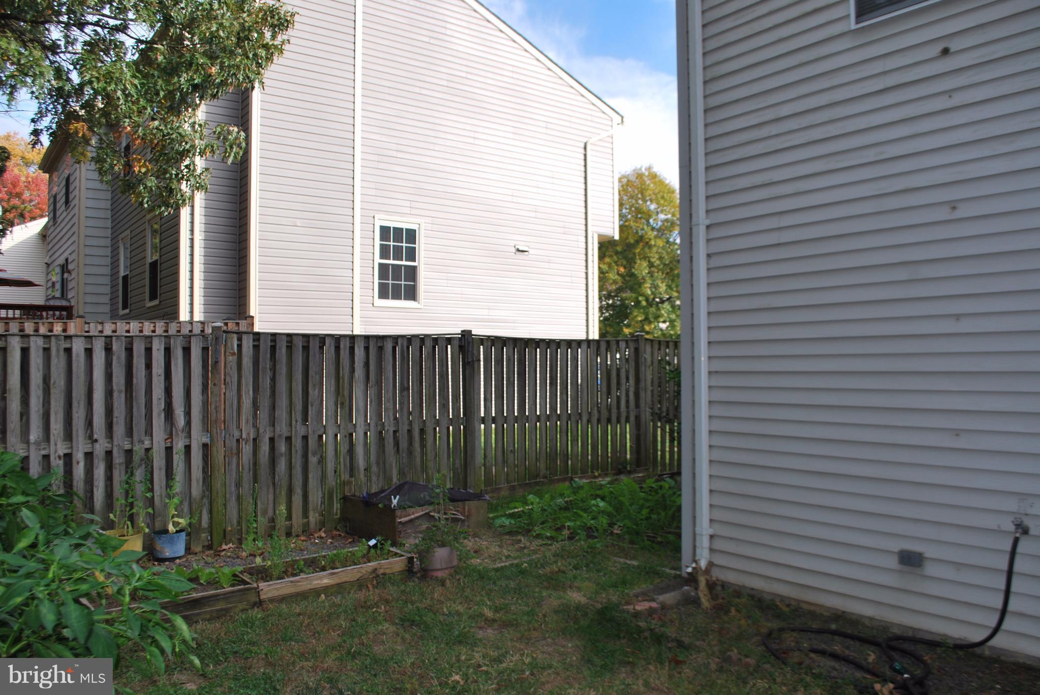 6900 Villa-Del-Rey Court Springfield, VA 22150 - Photo 16 of 29 a view of a house with a backyard