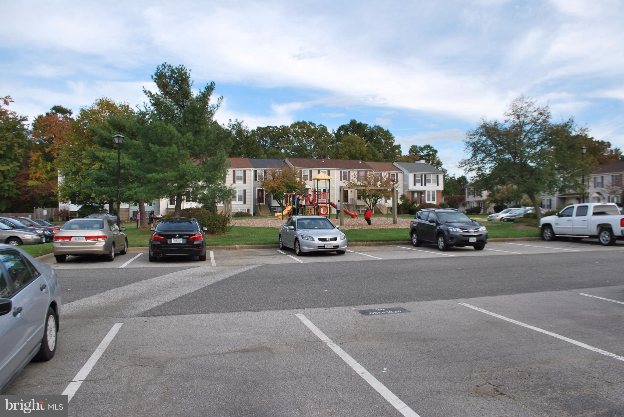 6900 Villa-Del-Rey Court Springfield, VA 22150 - Photo 24 of 29 a view of road with card parked on side and retail shops