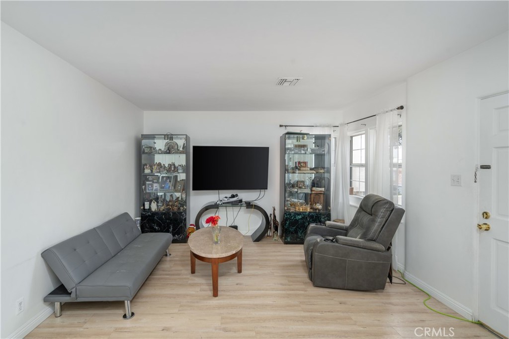 1020 Allen Avenue Glendale, CA 91201 - Photo 3 of 16 a living room with furniture a flat screen tv and a large window