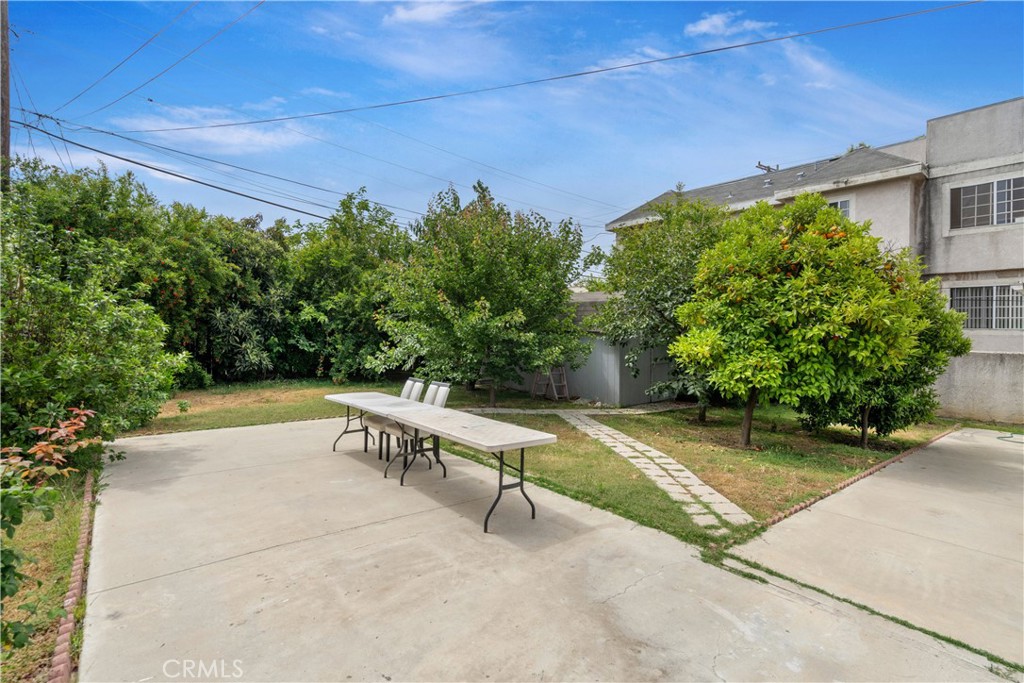 1020 Allen Avenue Glendale, CA 91201 - Photo 8 of 16 a view of a patio with a table and chairs and potted plants