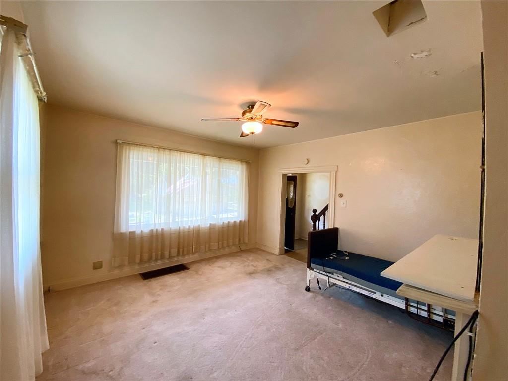 190 Whitestown Road Lyndora, PA 16045 - Photo 5 of 10 a room with gym equipment and a window