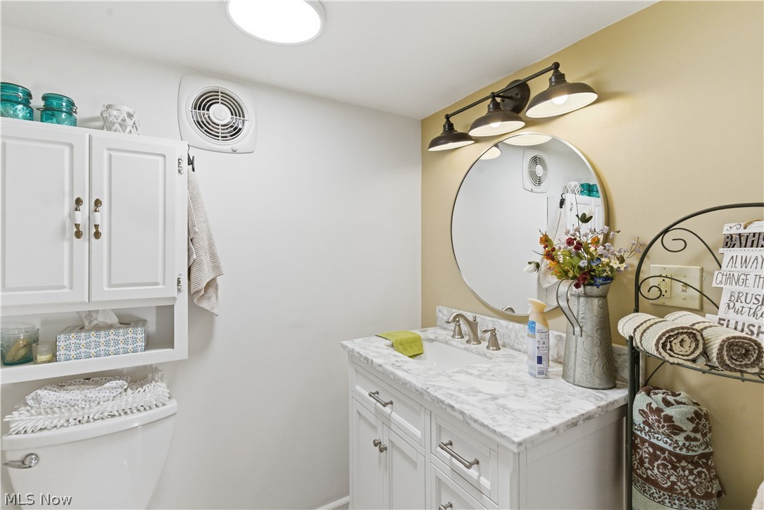52450 Tower Road Cumberland, OH 43732 - Photo 11 of 41 Bathroom with toilet and vanity