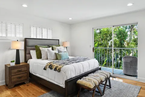 a spacious bedroom with a large bed and a fireplace
