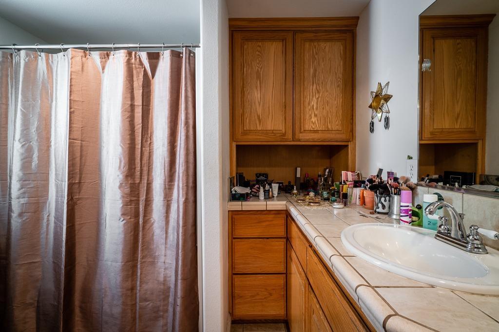 745 North Main Street Jackson, CA 95642 - Photo 12 of 25 a kitchen with sink a refrigerator and cabinets