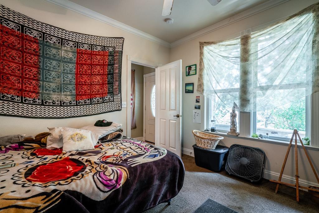 745 North Main Street Jackson, CA 95642 - Photo 14 of 25 a bedroom with a bed and a window