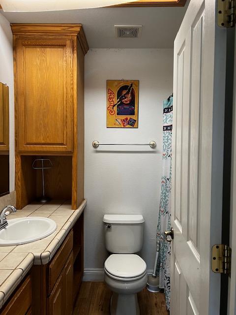 745 North Main Street Jackson, CA 95642 - Photo 24 of 25 a bathroom with a granite countertop toilet and a sink