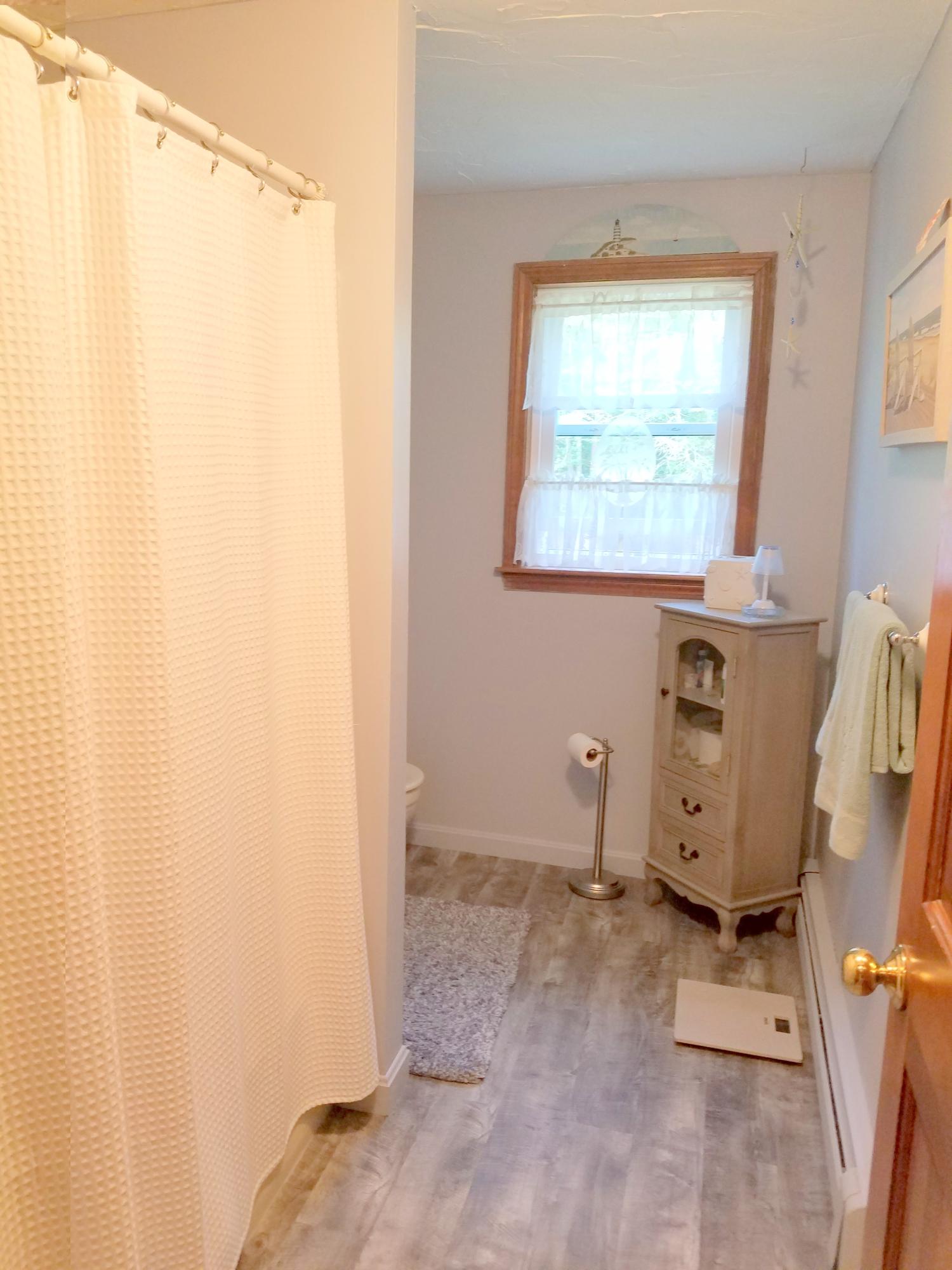 835 Cotuit Road Mashpee, MA 02649 - Photo 11 of 14 a view of a bathroom with window