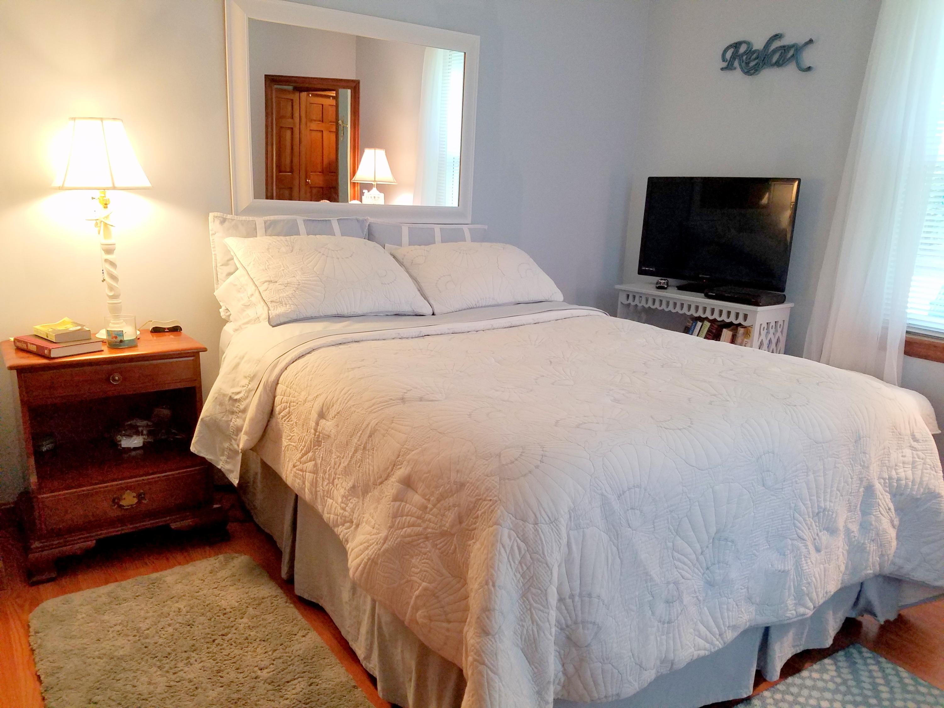 835 Cotuit Road Mashpee, MA 02649 - Photo 13 of 14 a bedroom with a bed and a flat screen tv