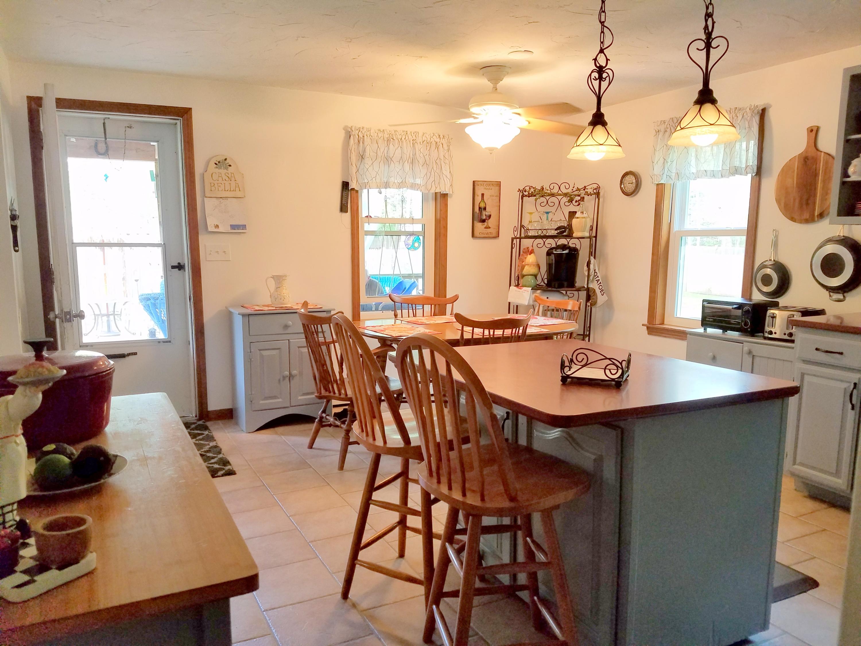 835 Cotuit Road Mashpee, MA 02649 - Photo 9 of 14 a view of a dining room with furniture and window