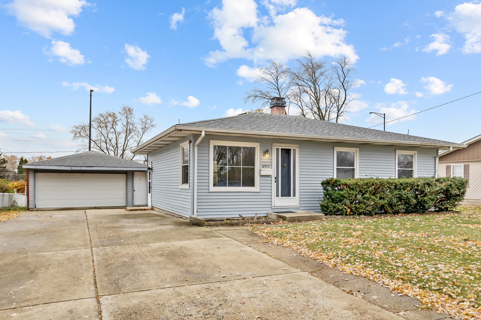 6971 Hanover Street Hanover Park, IL 60133 - Photo 1 of 20 a house view with a backyard space