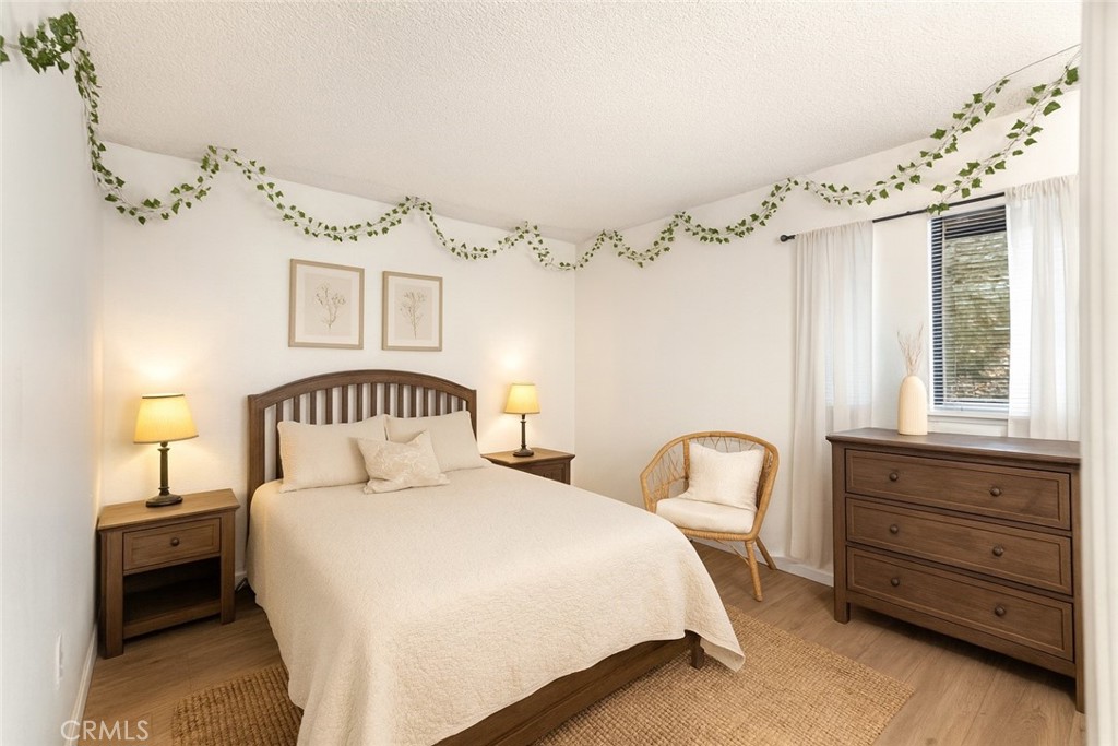 8333 Vineyard Avenue, Unit 4 Rancho Cucamonga, CA 91730 - Photo 11 of 22 a bedroom with a bed and a window