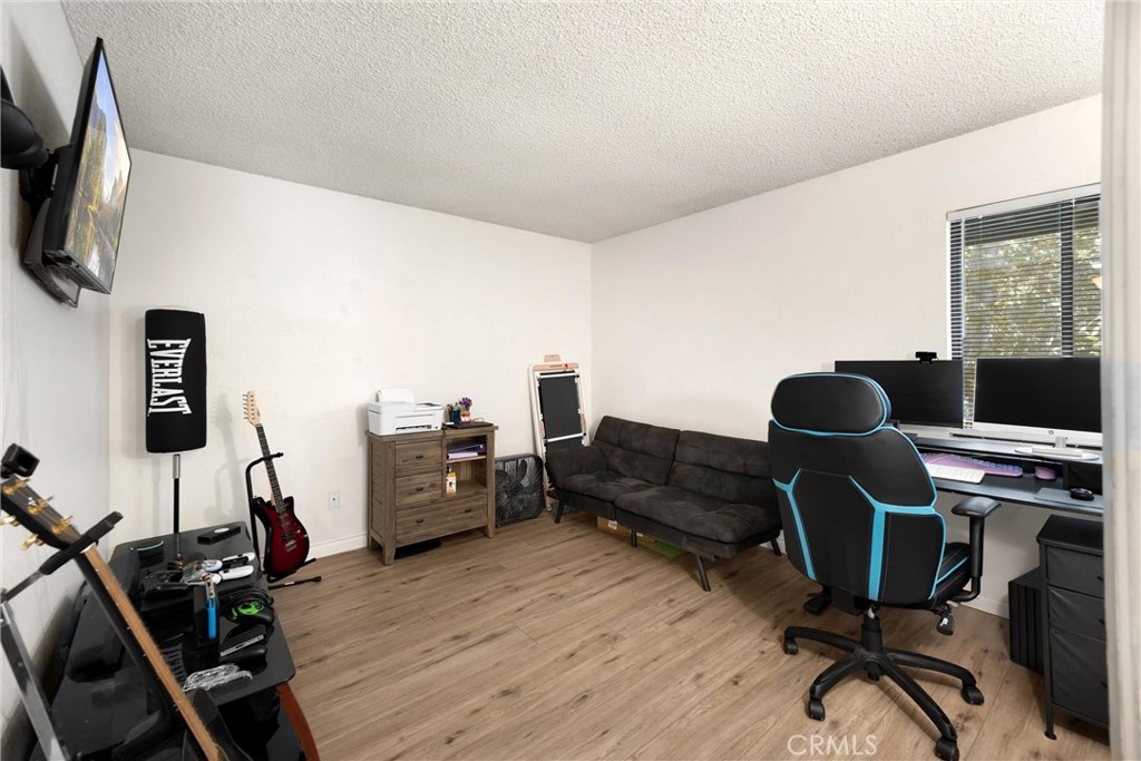 8333 Vineyard Avenue, Unit 4 Rancho Cucamonga, CA 91730 - Photo 12 of 22 a view of a workspace with furniture and gym equipment