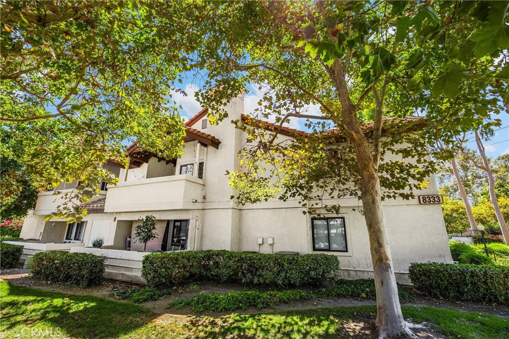 8333 Vineyard Avenue, Unit 4 Rancho Cucamonga, CA 91730 - Photo 17 of 22 a front view of a house with a garden
