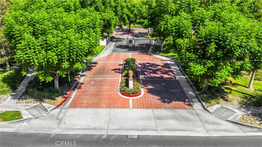 8333 Vineyard Avenue, Unit 4 Rancho Cucamonga, CA 91730 - Photo 19 of 22 an aerial view of a house with yard