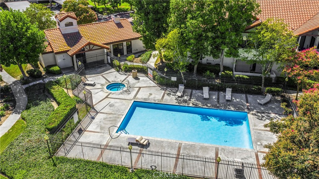 8333 Vineyard Avenue, Unit 4 Rancho Cucamonga, CA 91730 - Photo 22 of 22 an aerial view of a house with swimming pool and patio