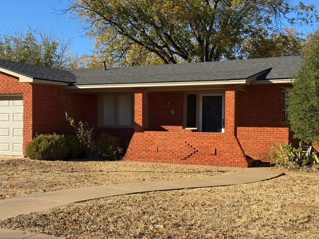 a view of a backyard of the house