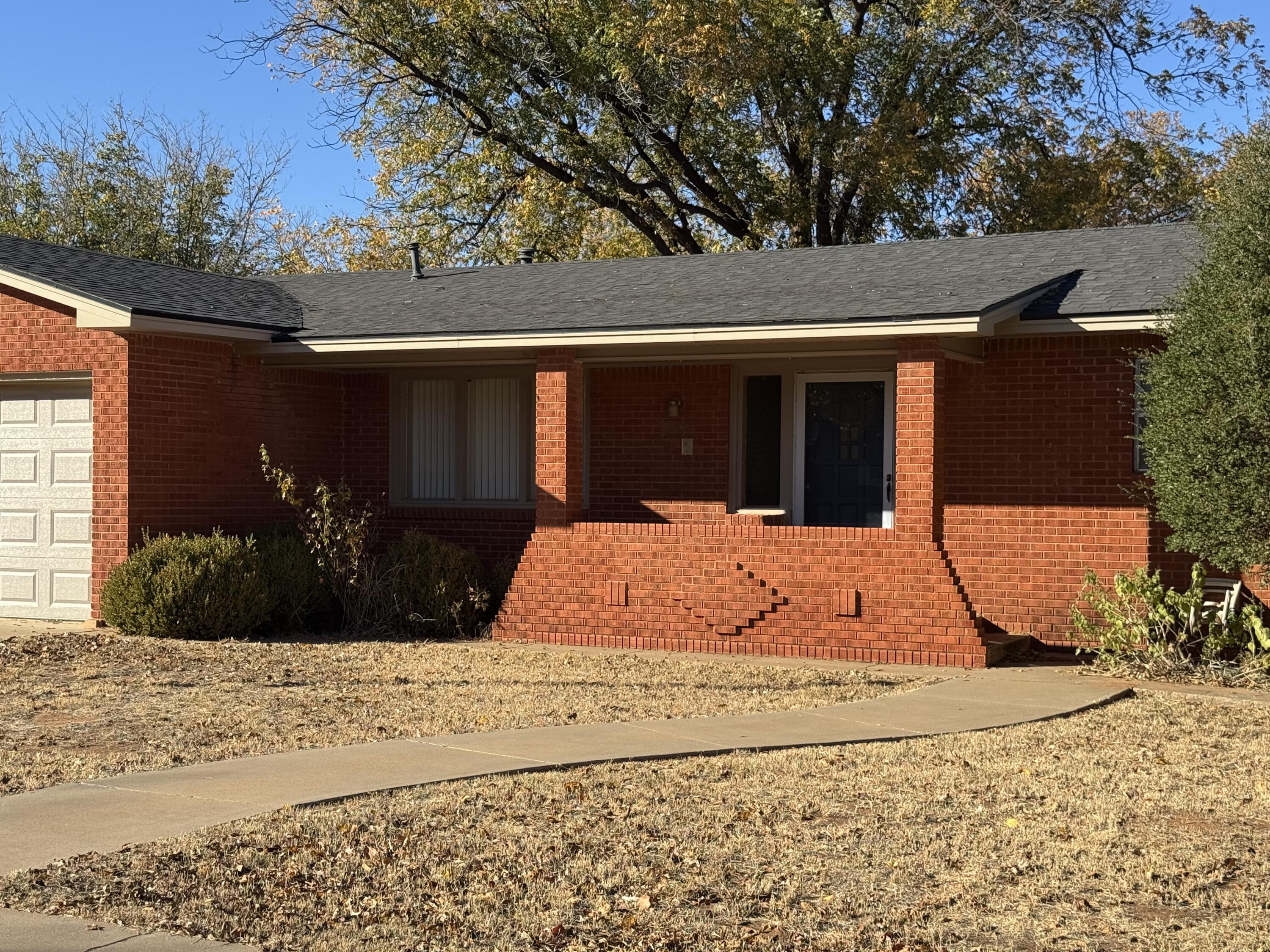 2208 South 4th Street Lamesa, TX 79331 - Photo 2 of 36 a view of a backyard of the house