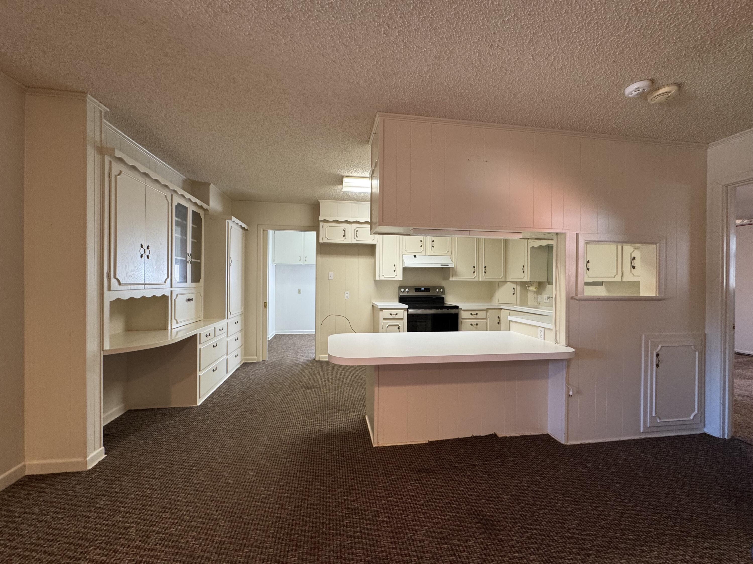 2208 South 4th Street Lamesa, TX 79331 - Photo 7 of 36 a view of kitchen with sink and refrigerator
