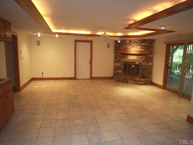 10005 Grafton Road Raleigh, NC 27615 - Photo 9 of 25 Plenty of space with its own fireplace and outside entrance this room is the perfect recreation room or mother-in-law suite!