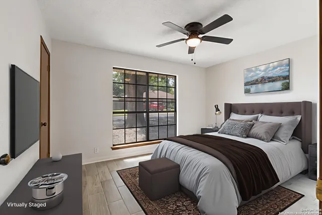 a bedroom with a bed and a window