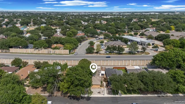 an aerial view of a house with a garden