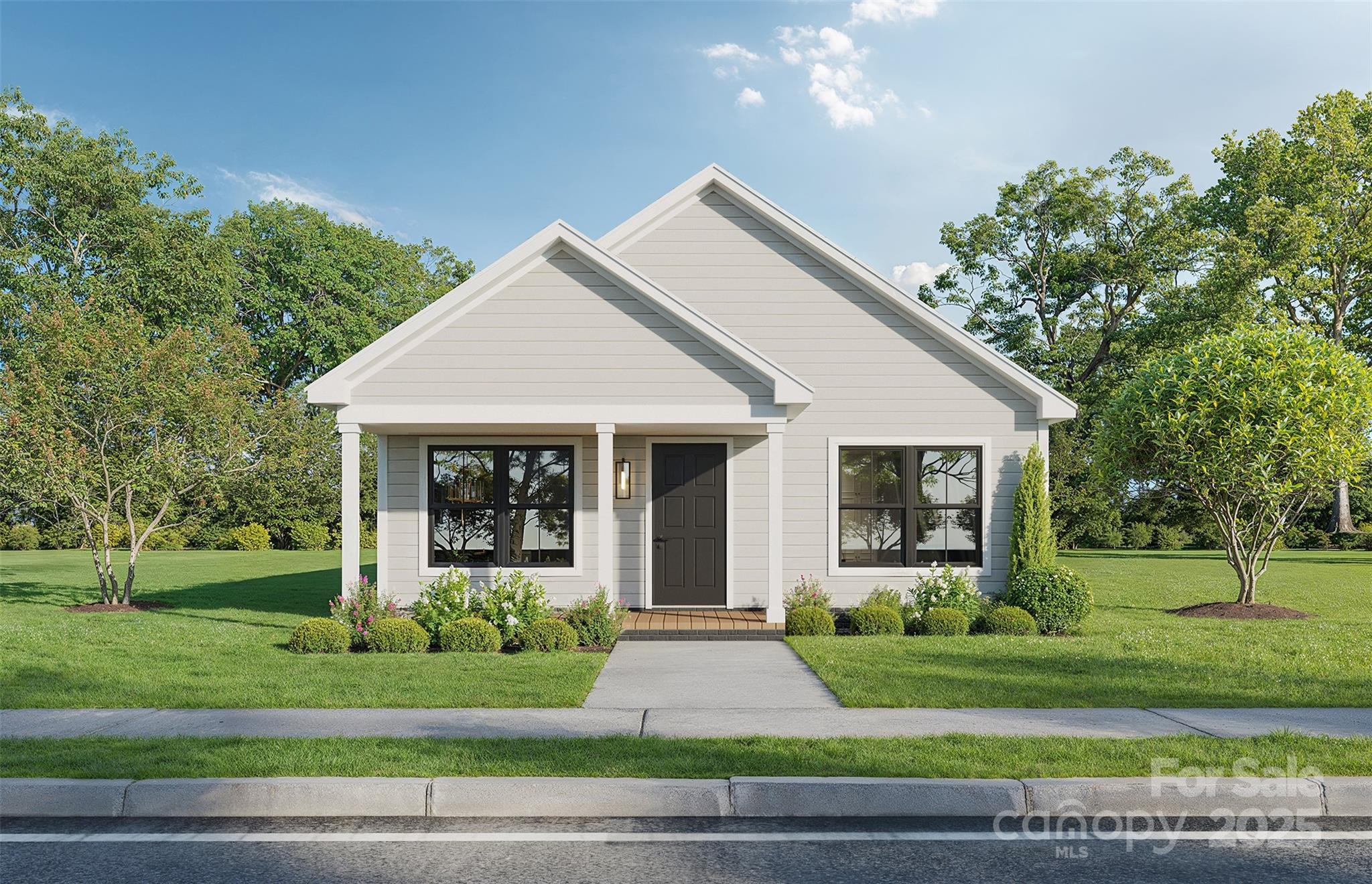 1 Lincoln Street Southwest Concord, NC 28025 - Photo 2 of 16 a front view of a house with a yard and potted plants