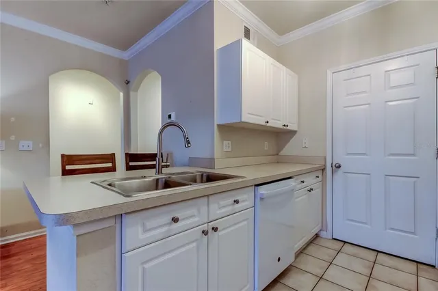 a kitchen with a sink and cabinets