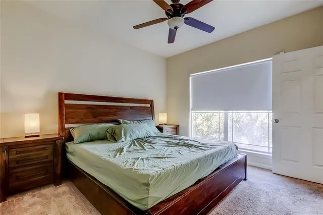 a bedroom with a bed and window