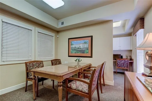 a view of a dining room with furniture