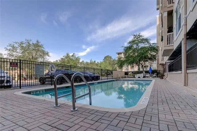 a view of a swimming pool with sitting area