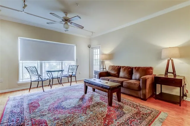 a living room with furniture and a rug