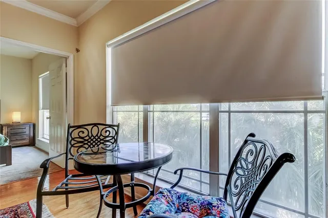 a view of a balcony with furniture and mirror