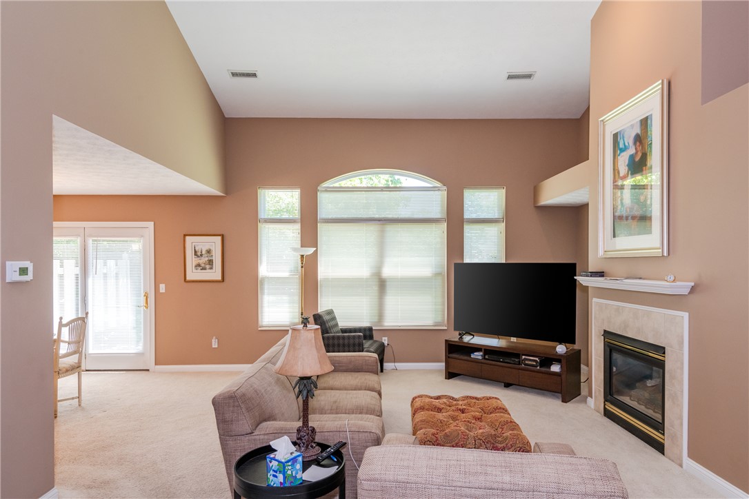 1105 Napa Ridge Dayton, OH 45458 - Photo 8 of 58 This living room features a fireplace and tall ceilings, creating an inviting space.