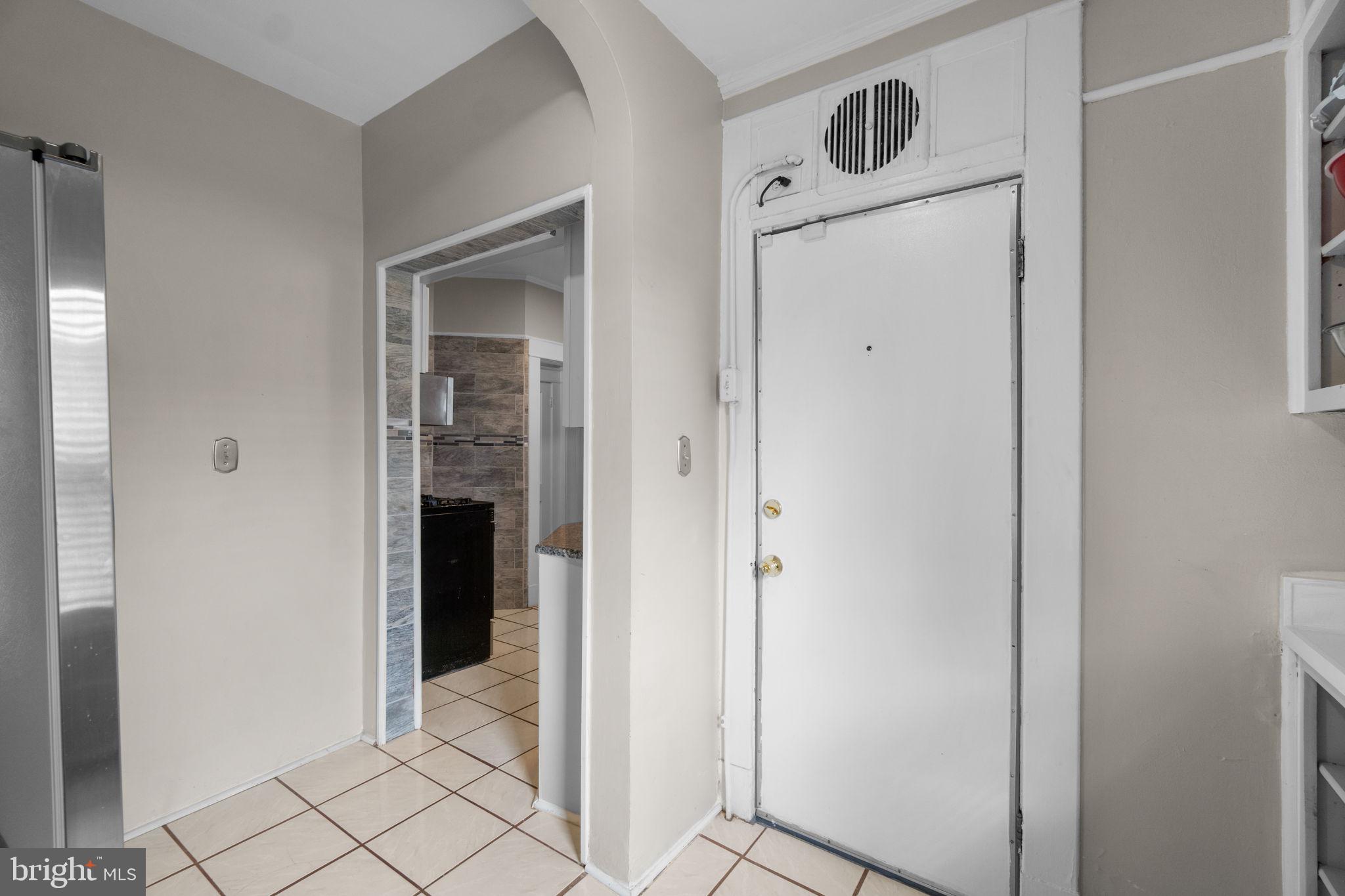 4213 Springdale Avenue Baltimore, MD 21207 - Photo 14 of 41 a view of an entryway with wooden floor