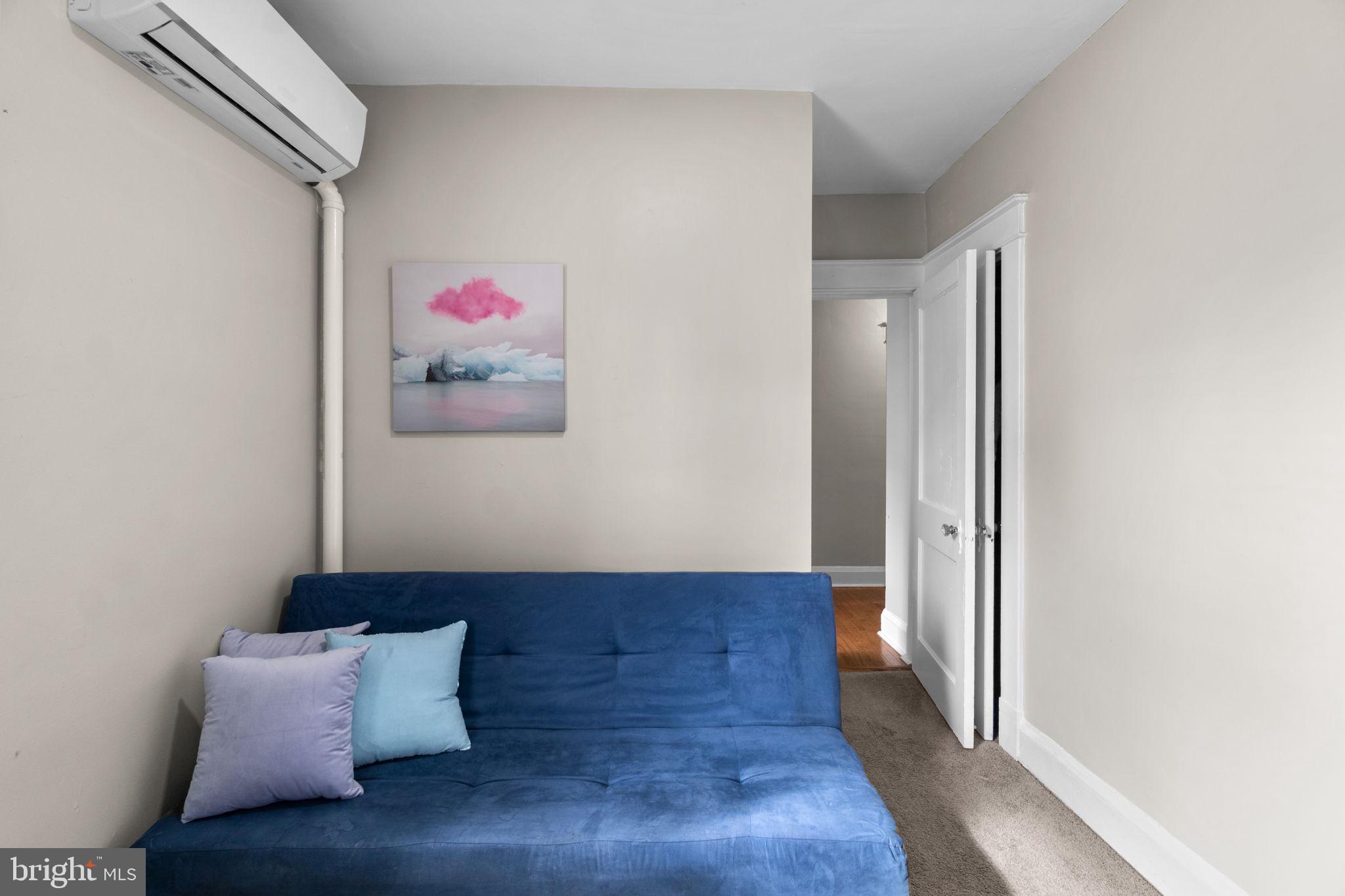 4213 Springdale Avenue Baltimore, MD 21207 - Photo 20 of 41 a living room with furniture and wall painting